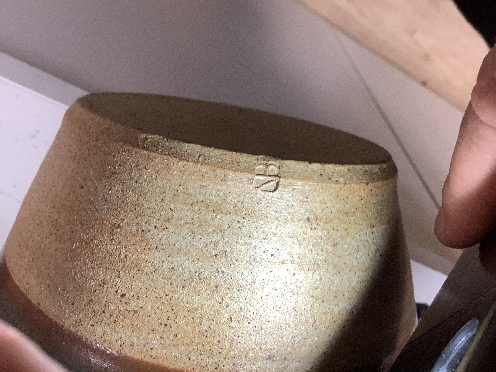 A group of studio pottery including a jar and cover, probably Norah Braden, 25 cm